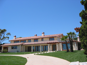 2 piece clay tile with copper gutters and custom chimney caps in Malibu